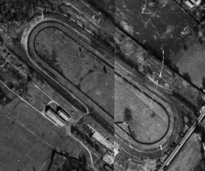 Detail of the 1967 county aerial survey showing the racing oval, a grandstand building and a row of barns, with a visible seam where two survey prints meet